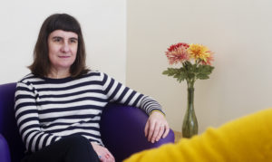 Seated female counsellor